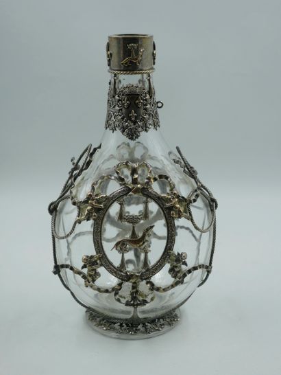 null Neo Renaissance glass decanter covered with a silver metal mesh with a medallion...