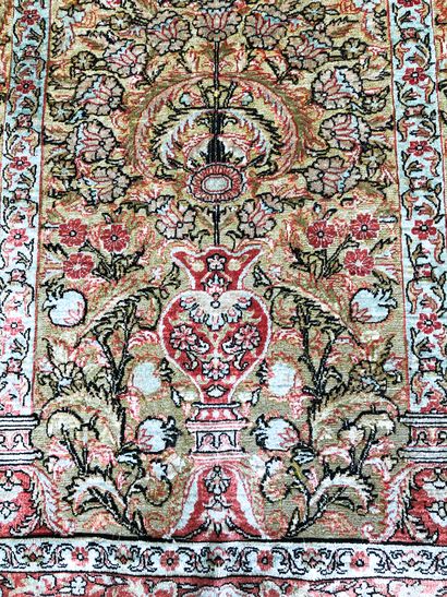 null HÉRÉKÉ carpet, circa 1960, in silk and gold thread, with a rich mirhab decoration...