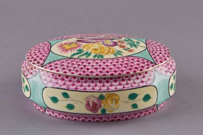 null LIMOGES, Porcelain oval candy box decorated with flowers in cartouches on a...