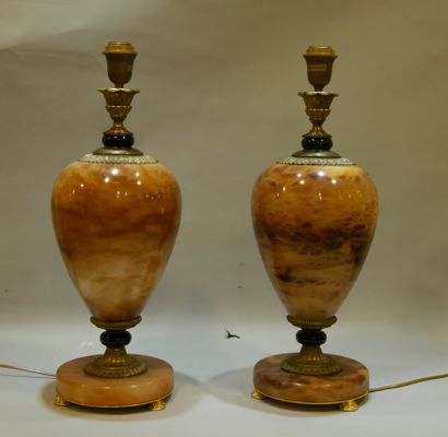 null A pair of brown onyx baluster lamp feet on pedestal, moiré and beige speckled,...
