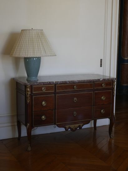 null Mahogany and mahogany veneer chest of drawers with a slight central projection,...