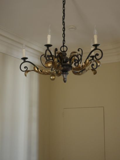 null Gilded wrought iron chandelier with five arms of light decorated with volutes...
