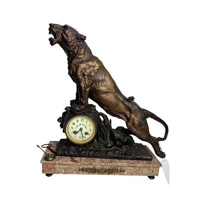 null French school end of XIXth century. Regula clock representing a wounded panther...