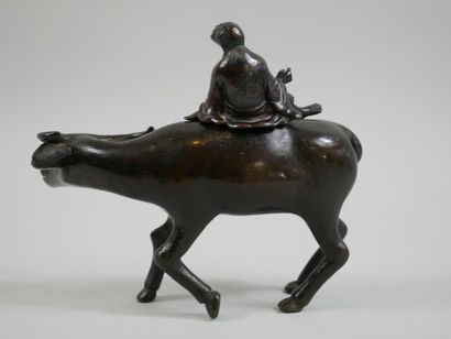 null 
JAPAN. Middle of the XIXth century. Character on a buffalo. Bronze perfume...