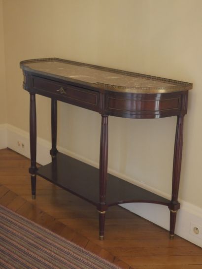null A Louis XVI style mahogany and mahogany veneer console table opening to a drawer...