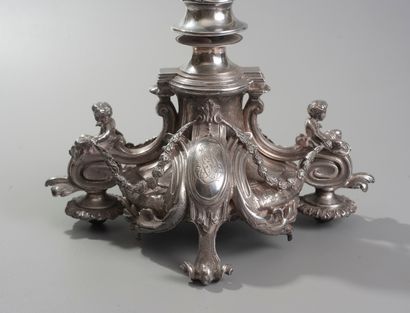 null A large silver plated bronze lamp stand, the baluster shaft decorated with twisted...