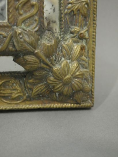null A brass mirror with a leaf, interlacing and shell motif. Regency style. 19th...