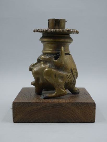 null Gilt bronze candlestick representing a chimera with a grimacing man's face,...