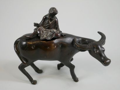 null 
JAPAN. Middle of the XIXth century. Character on a buffalo. Bronze perfume...