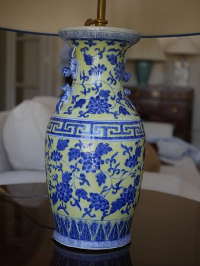 null CHINA, 20th century. A baluster-shaped lamp base decorated in blue on a yellow...