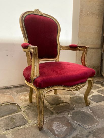  Carved and gilded wood cabriolet armchair, medallion back, curved legs, red velvet...