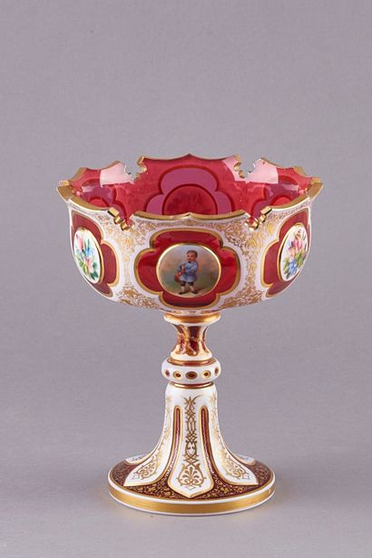 null A red and white glass overlay pedestal bowl, the rim with cut-out motifs and...