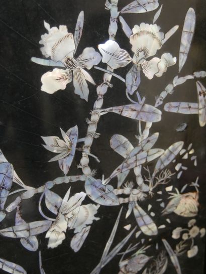null VIETNAM. Four lacquered and pearly panels decorated with birds on branches.100x30cm....