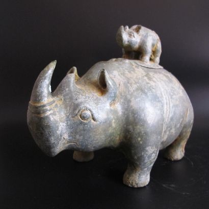 null Zun vase in the shape of a Rhinoceros, its small one forming the lid. Patinated...