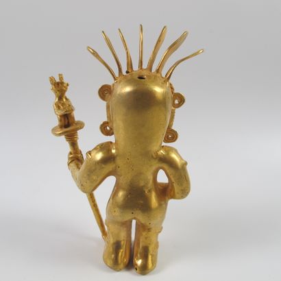 null Statuette of a standing shaman with a poporo ritual vase and a parrot sceptre....