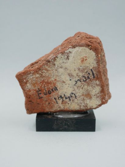 null Fragment of a votive lid face. Low fired clay of the Canaanite type from the...