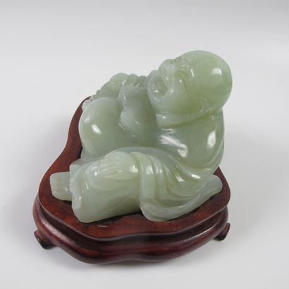 null Celadon putai on a wooden base. Nephrite jade or related. L 10 cm. H 8cm. China....