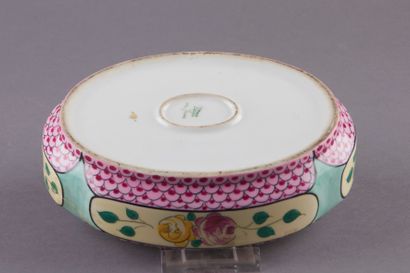 null LIMOGES. Porcelain oval candy box decorated with flowers in cartouches on a...