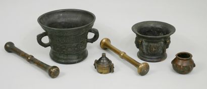 null Set of two bronze mortars, one decorated with masks, the other with a handle...