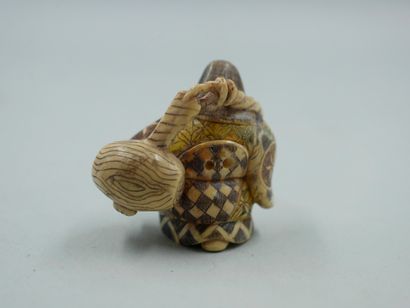 null Polychrome engraved ivory netsuke, The water carrier. Signed with the stamp....