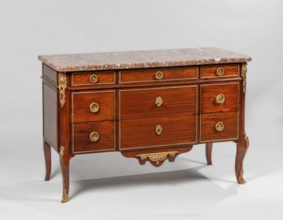 null Mahogany and mahogany veneer chest of drawers with a slight central projection,...