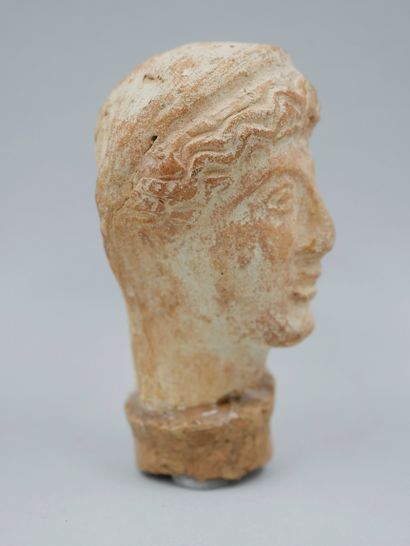 null Head with headband. Terracotta in the Grecoetruscan style.

Approx. H: 7cm