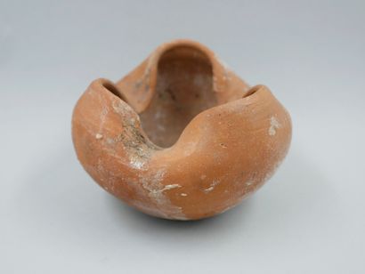 null Lamp representing a symbolic shell valve of the trilobate type. Terracotta....