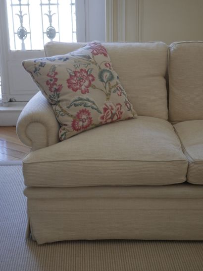 null Pair of three-seater sofas in ivory fabric, scrolled armrests. (Condition of...