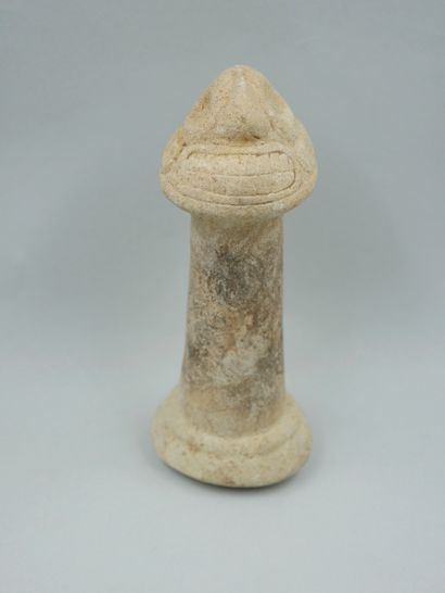 null Pestle decorated with a head of the god Zemi. Limestone. First millennium of...