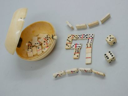 null Round bone box containing two dice and miniature bone domino pieces. Diam 6...