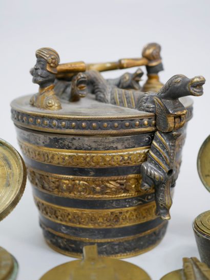 null Set of seven stacks of weights, called "Charlemagne weights" in gilt bronze...