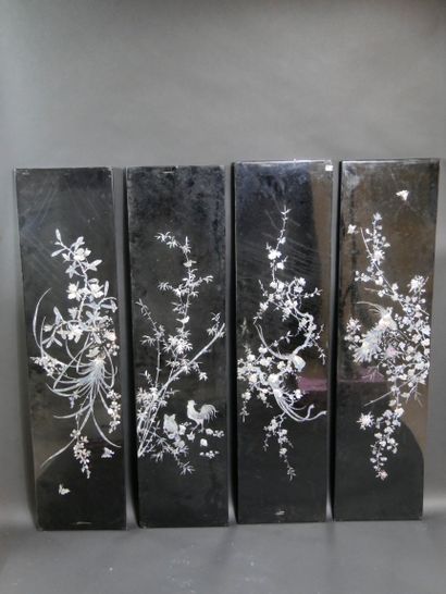 null VIETNAM. Four lacquered and pearly panels decorated with birds on branches.100x30cm....