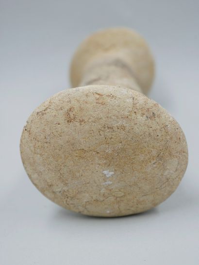 null Pestle decorated with a head of the god Zemi. Limestone. First millennium of...