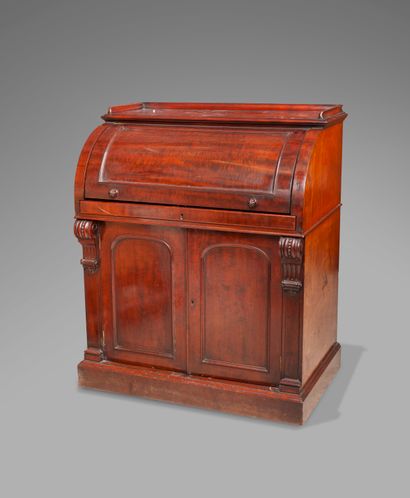 null 
A mahogany and mahogany veneer cylinder desk opening to two valances, the top...