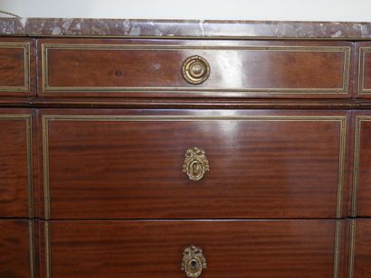 null Mahogany and mahogany veneer chest of drawers with a slight central projection,...