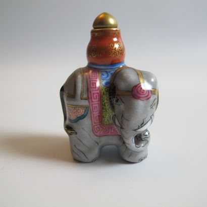 null Three porcelain and enamel flasks. Elephant (h 6 cm), octahedron with 8 Buddhist...