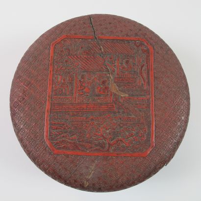 null Circular box made of finely carved cinnabar lacquer. D 17cm. H 7.5cm. Lid decorated...