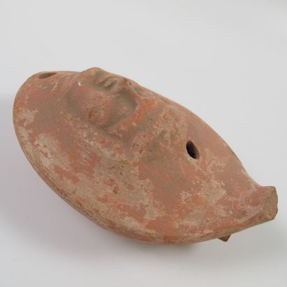 null Oil lamp decorated with a mask of the Goddess Isis. Terracotta. As is (handle...