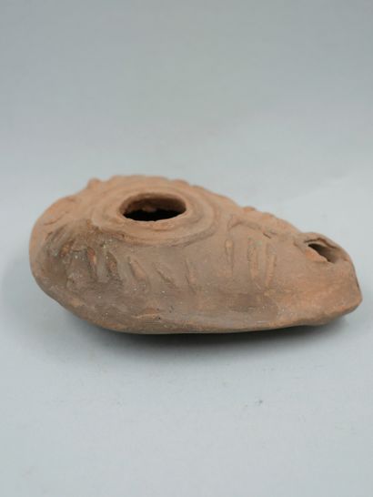 null Oil lamp. Terracotta. Decorated with a Iota and an omicron. Probably related...