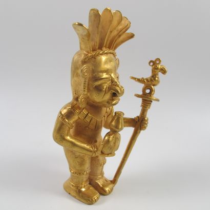 null Statuette of a standing shaman with a poporo ritual vase and a parrot sceptre....