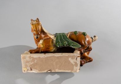 null CHINA, in the Tang style. Semi-sitting horse on a terrace. Terracotta with sancai...