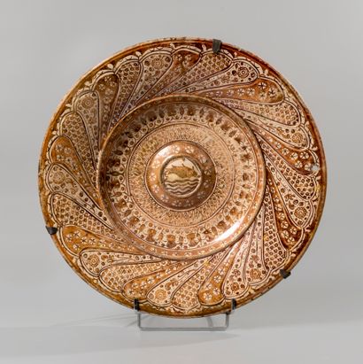 null MANISSES, Valencia. Two large circular earthenware umbilical dishes decorated...