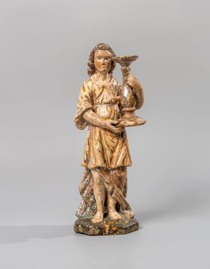 null Polychrome wooden sculpture representing a cerulean angel holding a baluster-shaped...