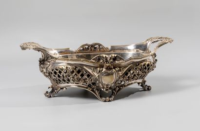 null A silvered bronze openwork planter with four blind cartouches in a frame of...