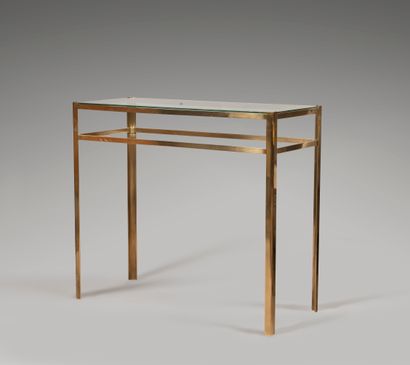 null Rectangular console in gilded metal. It stands on four legs and is decorated...