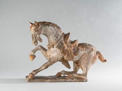 null CHINA, in the Tang style. Semi-sitting horse on a terrace. Terracotta and partial...