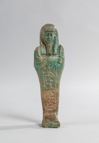 null Inscribed oushebti in green frit probably of a priest of Amun. Ca 665-332 B.C....