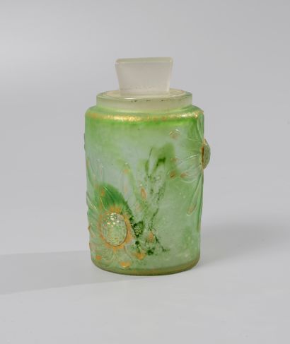 null DAUM Nancy. Toilet bottle in green opacified glass decorated with daisies engraved...