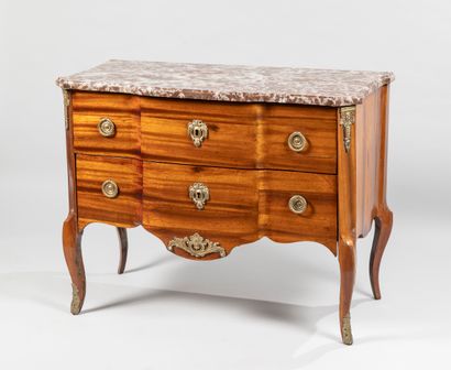 A satinwood veneer chest of drawers opening...