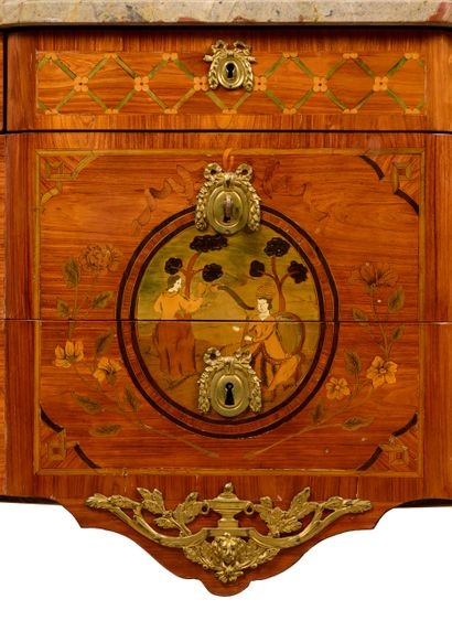 null A double flush chest of drawers made of veneered wood inlaid with flowering...